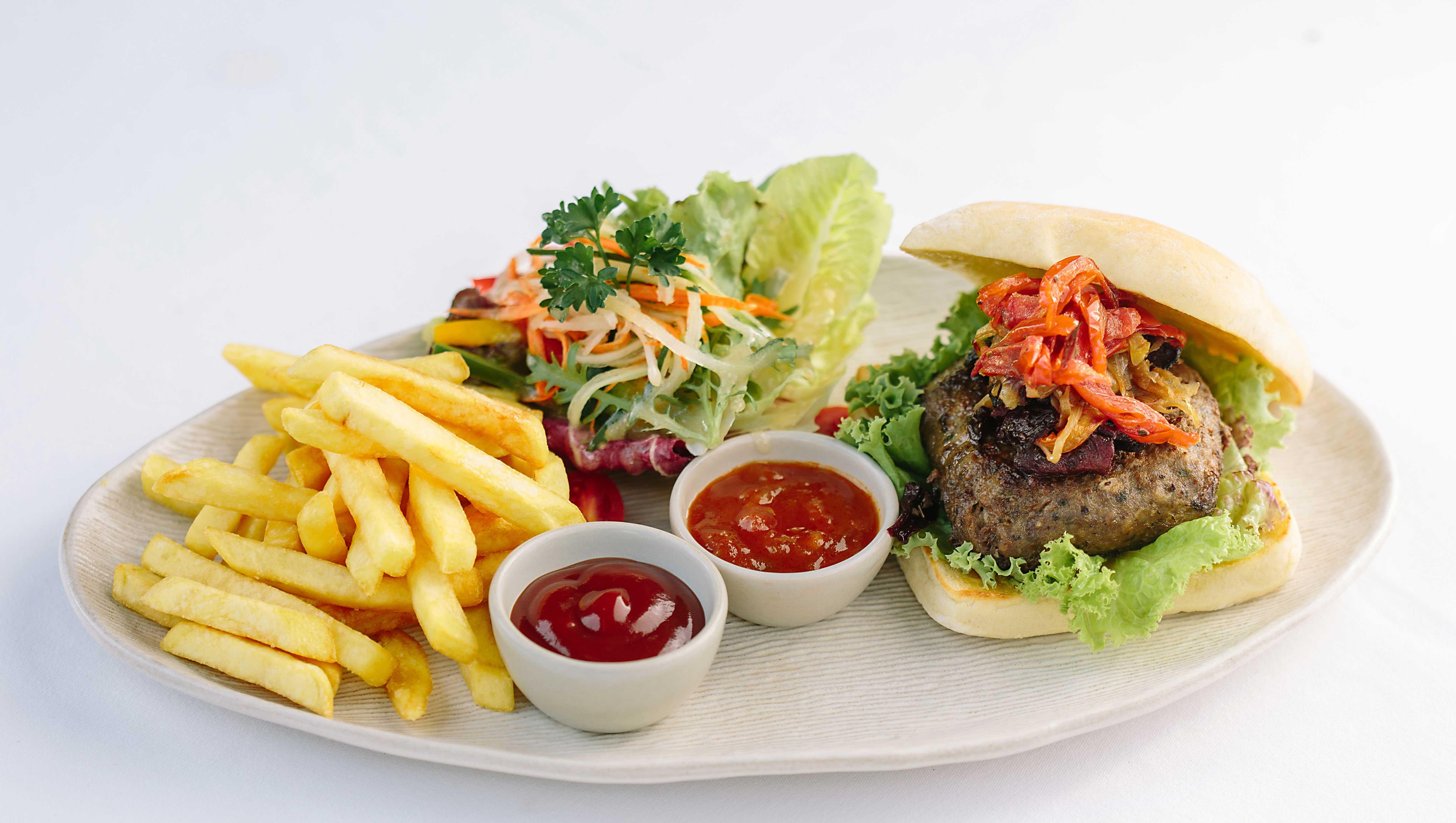 Tejaprana Resort & Spa Ubud Exterior foto A hamburger with chips and salad